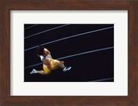 High angle view of a young man running on a running track Fine Art Print