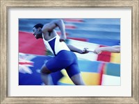 Side profile of runners passing a baton in a relay race Fine Art Print