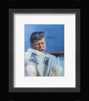President Kennedy Reading the New York Times Framed Print
