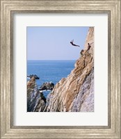 Male cliff diver jumping off a cliff, La Quebrada, Acapulco, Mexico Fine Art Print