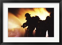 Firefighters Extinguishing A Fire With Water Framed Print