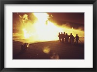 High angle view of firefighters extinguishing a fire Framed Print