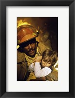 Firefighter carrying a boy Fine Art Print