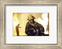 Firefighter carrying a boy Fine Art Print