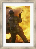 Rear view of a firefighter holding an axe Fine Art Print