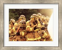 Group of firefighters spraying water with a fire hose Fine Art Print