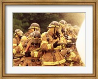 Group of firefighters spraying water with a fire hose Fine Art Print