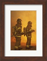 Rear view of two firefighters extinguishing a fire Fine Art Print