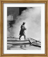 Firefighter walking in front of smoke Fine Art Print