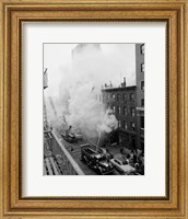 New York City, Fire on East 47th Street, with fire engines shooting water on burning building Fine Art Print