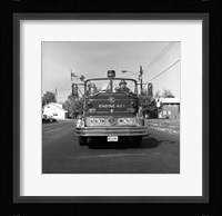 Fire engine on road Framed Print