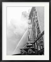 Fire engine with ladder up burning building Fine Art Print