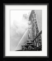 Fire engine with ladder up burning building Fine Art Print