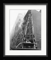 Fire engine with ladder up burning building Fine Art Print