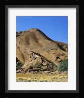 Tourists climbing on a rock, Ayers Rock, Uluru-Kata Tjuta National Park, Australia Fine Art Print