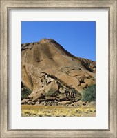 Tourists climbing on a rock, Ayers Rock, Uluru-Kata Tjuta National Park, Australia Fine Art Print