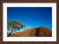 Rock formation on a landscape, Ayers Rock, Uluru-Kata Tjuta National Park, Northern Territory, Australia Fine Art Print