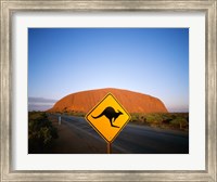 Kangaroo sign on a road with a rock formation in the background, Ayers Rock Fine Art Print