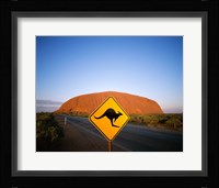 Kangaroo sign on a road with a rock formation in the background, Ayers Rock Fine Art Print