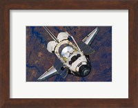 The Space Shuttle Discovery approaches the International Space Station Fine Art Print