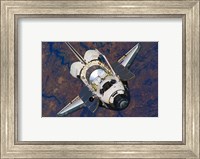 The Space Shuttle Discovery approaches the International Space Station Fine Art Print