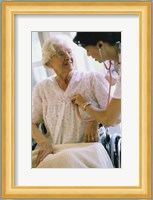 Female nurse checking a female patient's heartbeat Fine Art Print