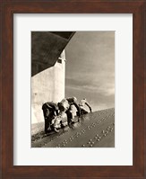Three construction workers putting a coat of paint on a slanted wall of riveted-steel plates on the Hoover Dam spillway Fine Art Print