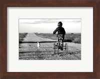 Rear view of a girl riding a bicycle Fine Art Print