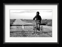 Rear view of a girl riding a bicycle Fine Art Print