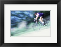 Side profile of a young man riding a bicycle Fine Art Print