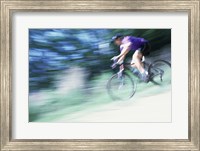 Side profile of a young man riding a bicycle Fine Art Print