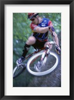 Young man on a bicycle Framed Print
