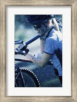 Young woman carrying a bicycle on her shoulders Fine Art Print