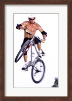 Young man on a bicycle in mid-air Fine Art Print