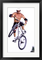 Young man on a bicycle in mid-air Framed Print