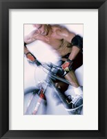 Close-up of a young man riding a bicycle Fine Art Print