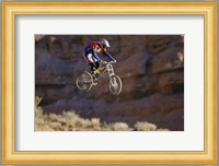 Side profile of a person on a bicycle in mid air Fine Art Print