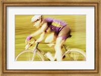 Side profile of a young man cycling Fine Art Print