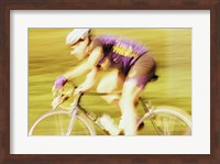 Side profile of a young man cycling Fine Art Print