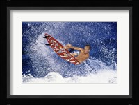 Surfing in action Framed Print