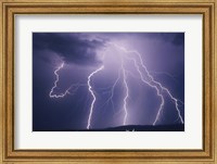 Lightning bolts striking the earth Fine Art Print
