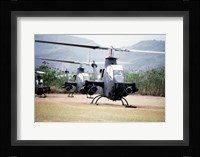 Three AH-1 Cobra gunship helicopters Fine Art Print