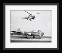 Low angle view of a helicopter in flight and an airplane at an airport, Sikorsky Helicopter, Douglas DC-4 Fine Art Print