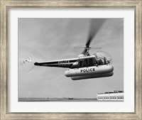 Low angle view of a helicopter in flight, Bell 47-D, Bell Aircraft Corporation Fine Art Print