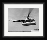 Low angle view of a helicopter in flight, Bell 47-D, Bell Aircraft Corporation Fine Art Print