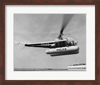 Low angle view of a helicopter in flight, Bell 47-D, Bell Aircraft Corporation Fine Art Print
