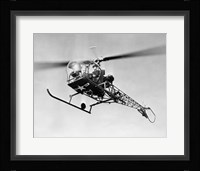 Low angle view of military helicopter in flight Fine Art Print