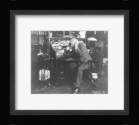 Thomas Alva Edison using his dicatating machine Framed Print