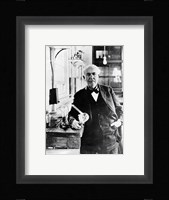 Thomas Edison with the first light bulbs Framed Print