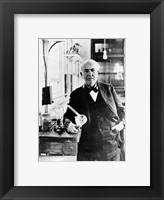 Thomas Edison with the first light bulbs Framed Print